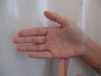 Image of hands doing EFT tapping.